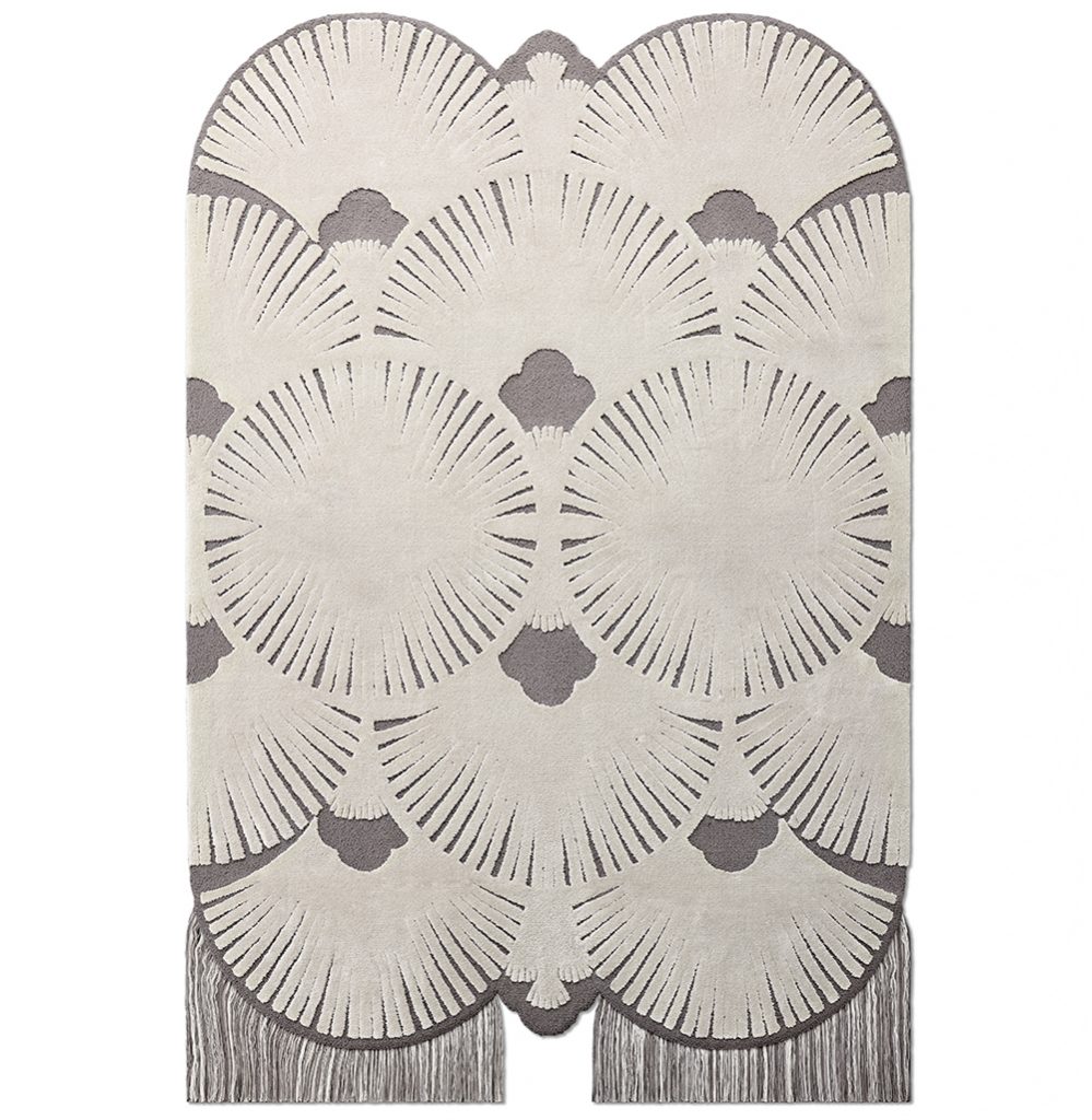 Modern contemporary area rug in white and gray tones with hanging fringes. 8 Fall Rugs We Love For The Living Room