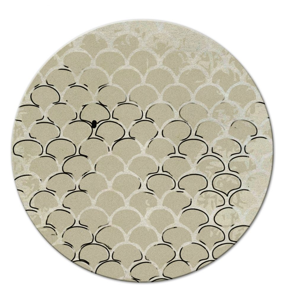 neutral round rug with a design inspired by the koi fish. rug ideas