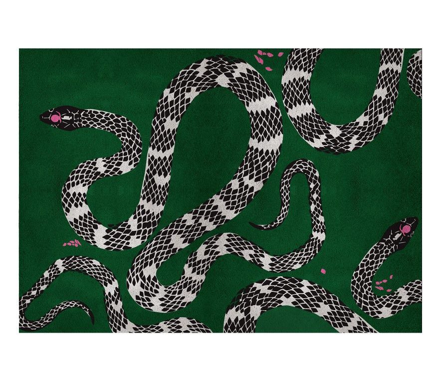 green contemporary area rug with a snake pattern that stands out against the vibrant green background. Solving Spaces - Bespoke House Decoration With Modern Rugs