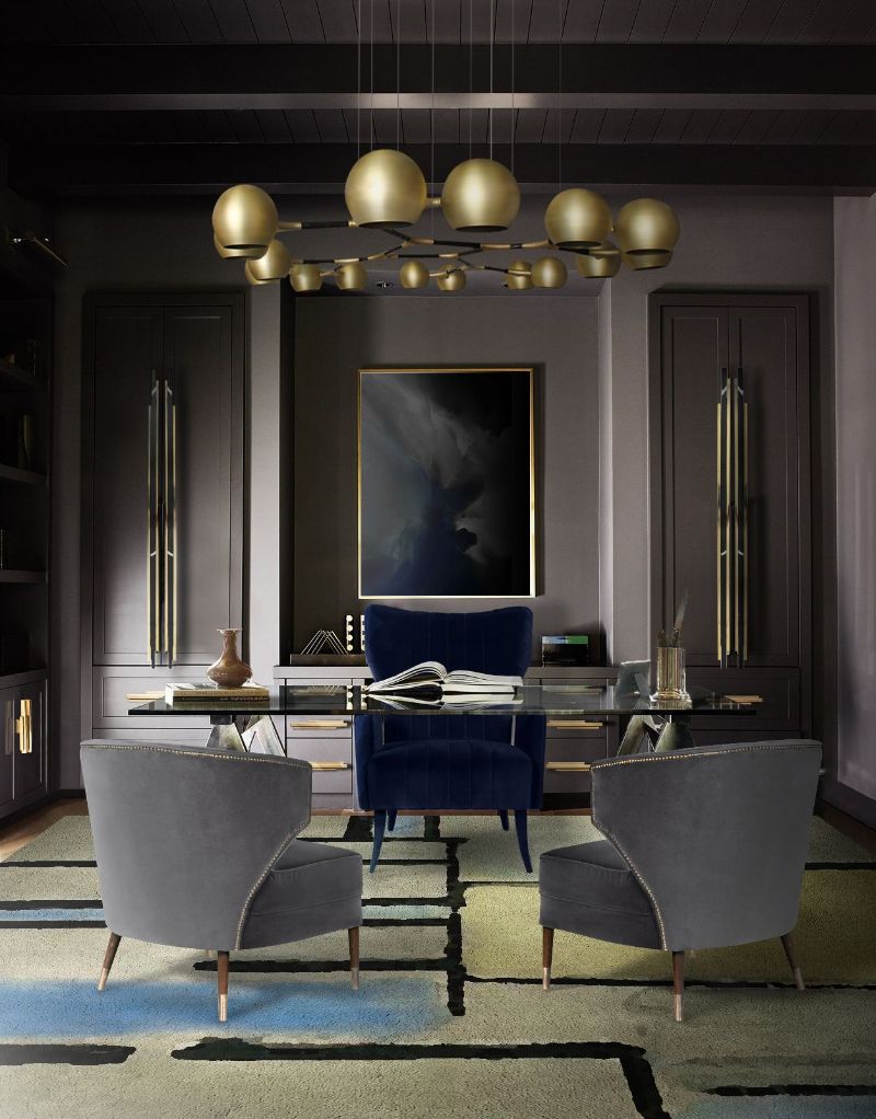 The IVO Rug decorates this Modern Contemporary Office and transforms it into a more interesting room. The IVO rug stands out from the rest thanks to its unusual geometric pattern and color palette that contrasts with the gray tones of the wall and the chairs.