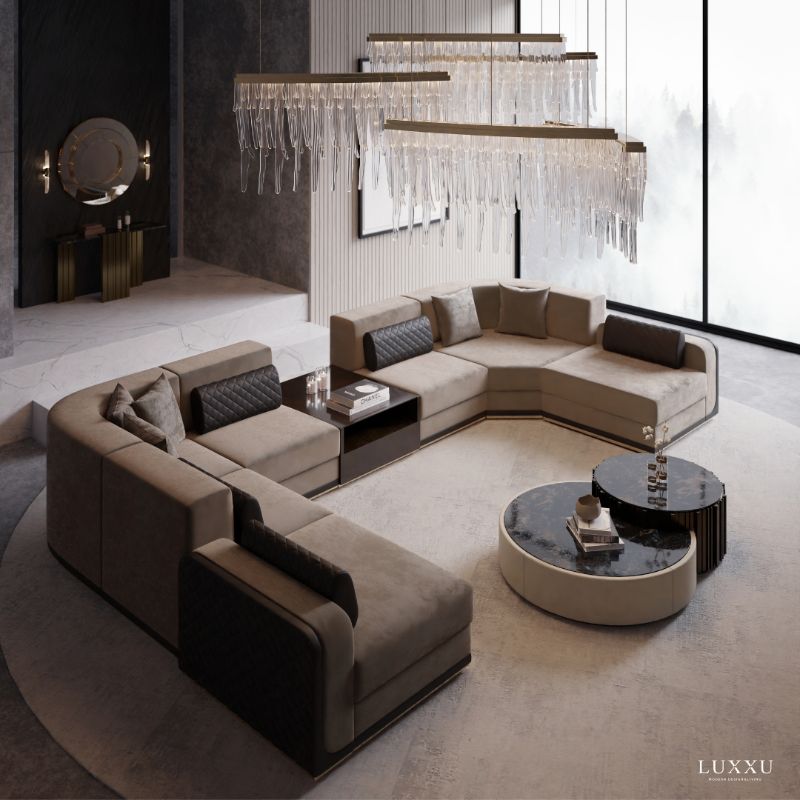 The Best Modern Rugs For Your Living Room & Hallway, Modern Classic Living Room with a light gray areal rug. This rug by its color emphasis how spacious the room actual is and highlights how minimalistic it is with a touch of sophistication with the hanging chandeliers.
