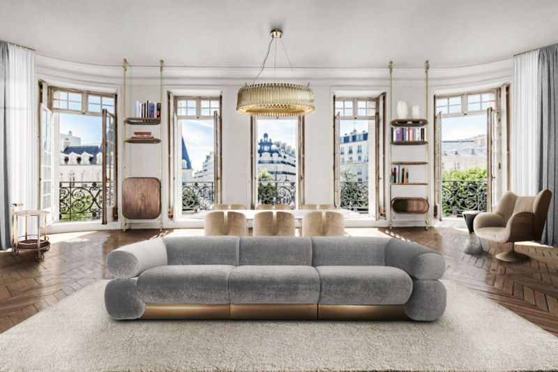 The Best Modern Rugs For Your Living Room & Hallway, Modern Living Room in golden and light gray colors. A white areal rug highlights the space of the room while the golden chandelier and chairs bring a touch of color and a sense of sophistication.