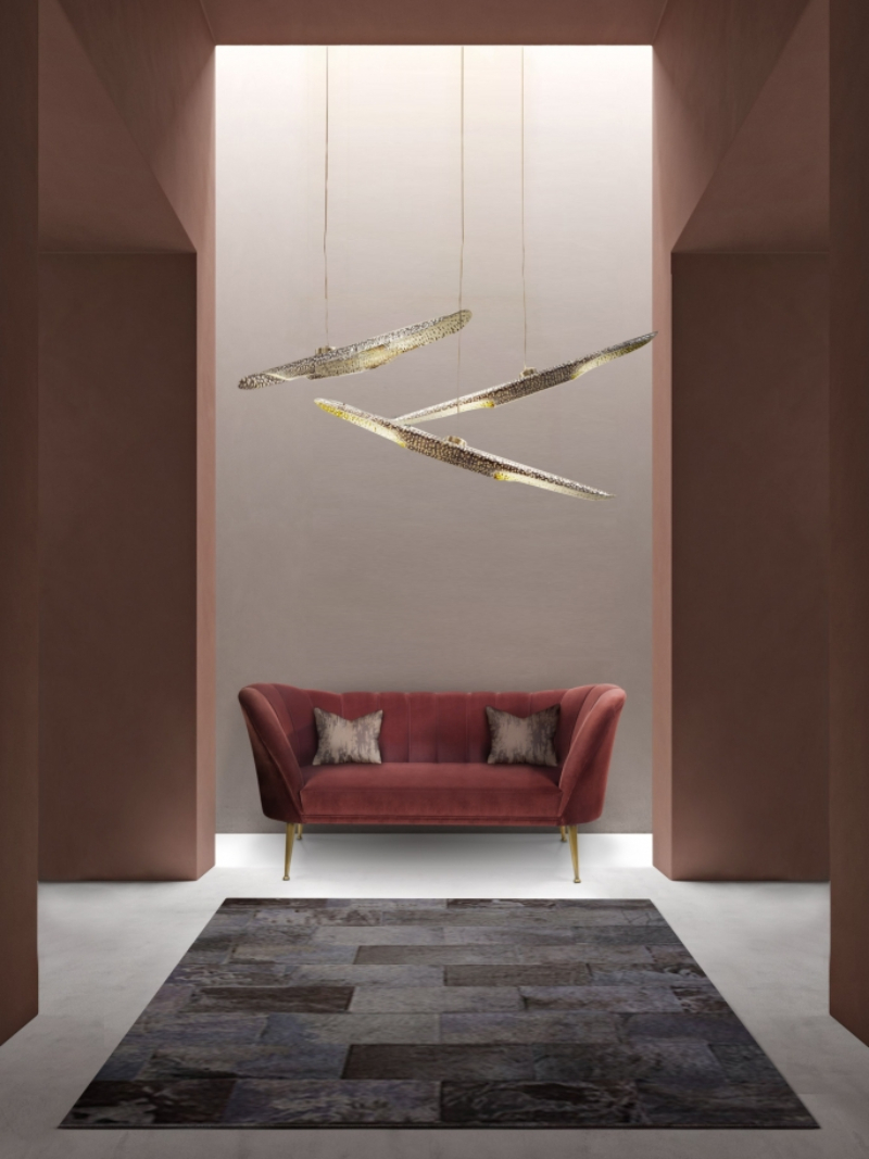 Modern hallway with leather rug in black with red sofa and suspension lights