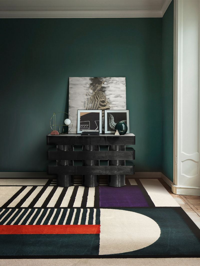 modern contemporary hallway with geometric PRISMA 1 rug in blue and white with a touch of orange and black console. 10 Insane Modern Rugs For A Stylish Interior
