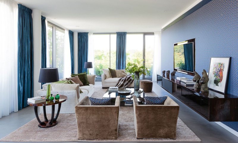 Paris 56 Fine Interiors with Fine Rugs; Berlin Living room penthouse with a beautiful brown rug, complementing the living room colors.