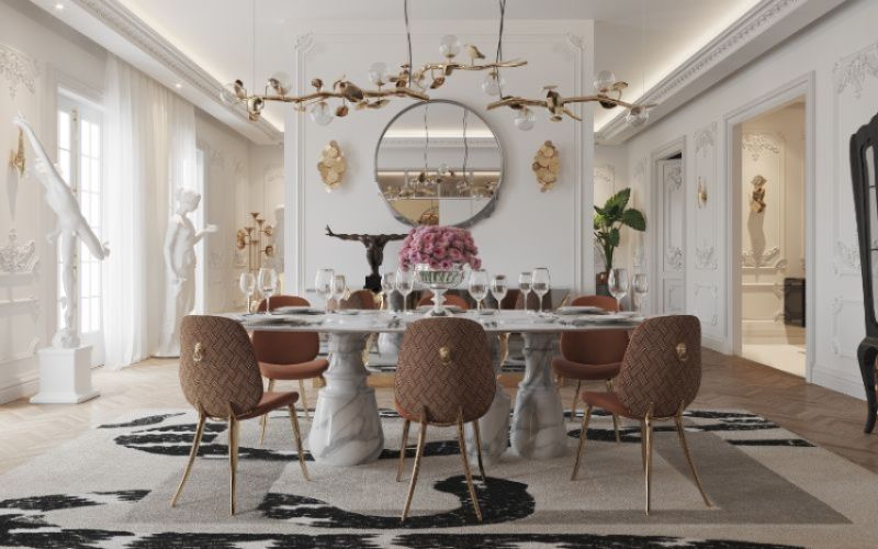 Modern classic dining room with imperial snake rug, soleil dining chairs and golden lights. There is a marbled dining table and a round gold mirror.