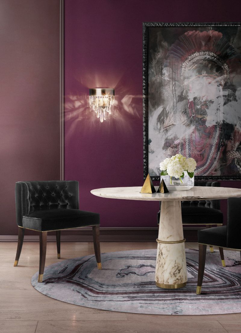 Beautiul dining room with round ahagathe rug in blue tones and agra round table