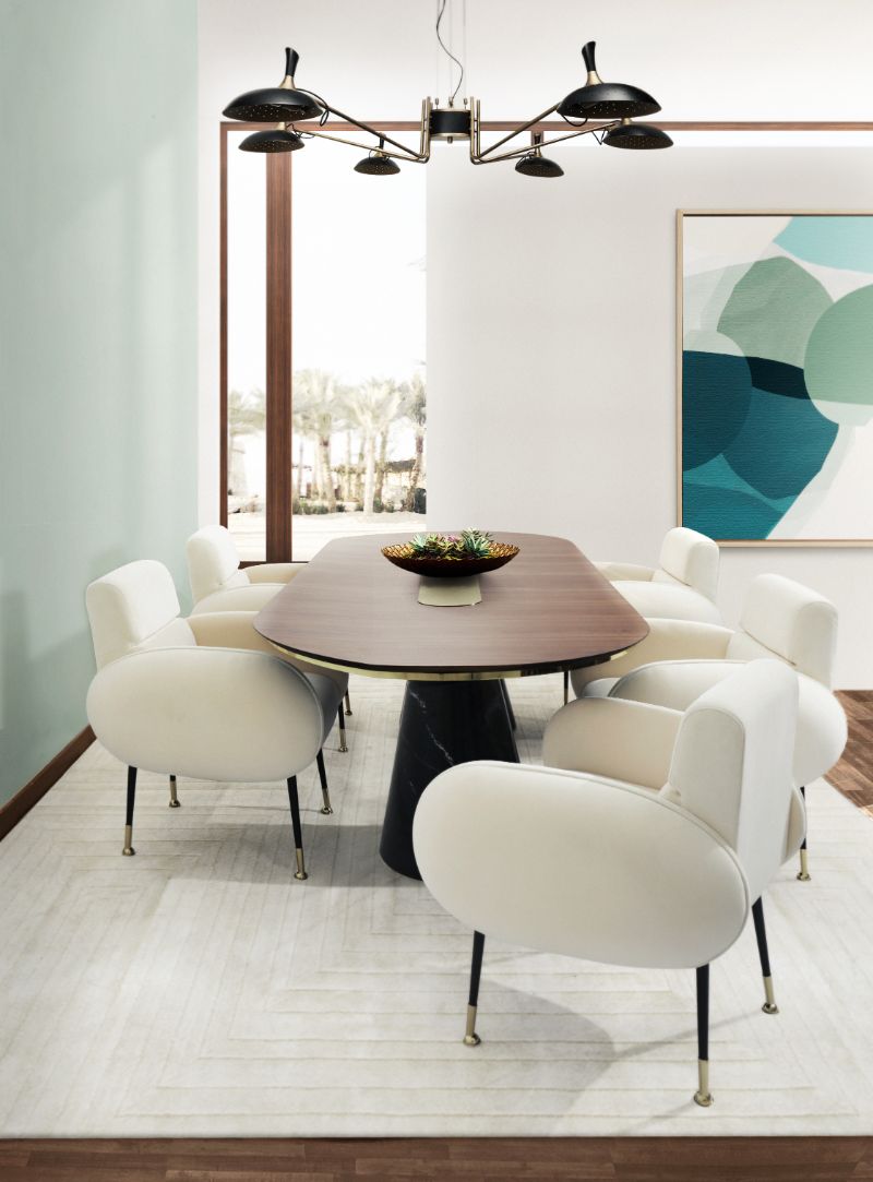 mid-century dining room with white garden rug and white plump dining chairs and round dining table