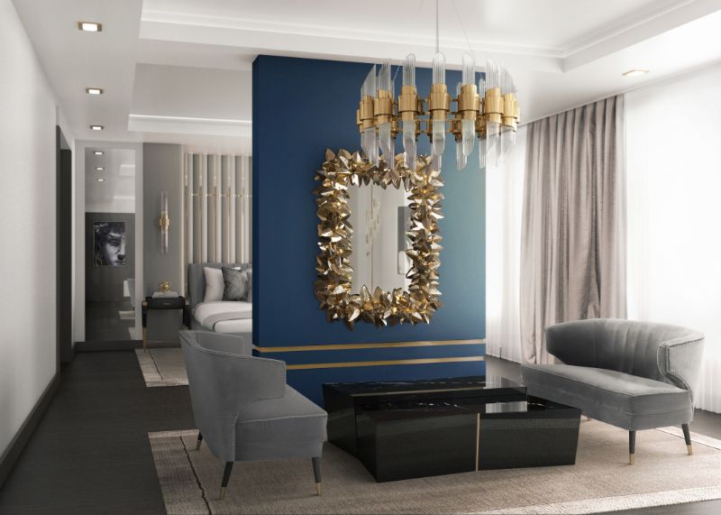 living room with beige rug and mcqueen wall light mirror, black center table and gray armchairs