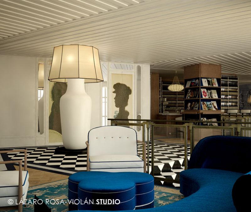 lobby with blue sofa and white armchairs