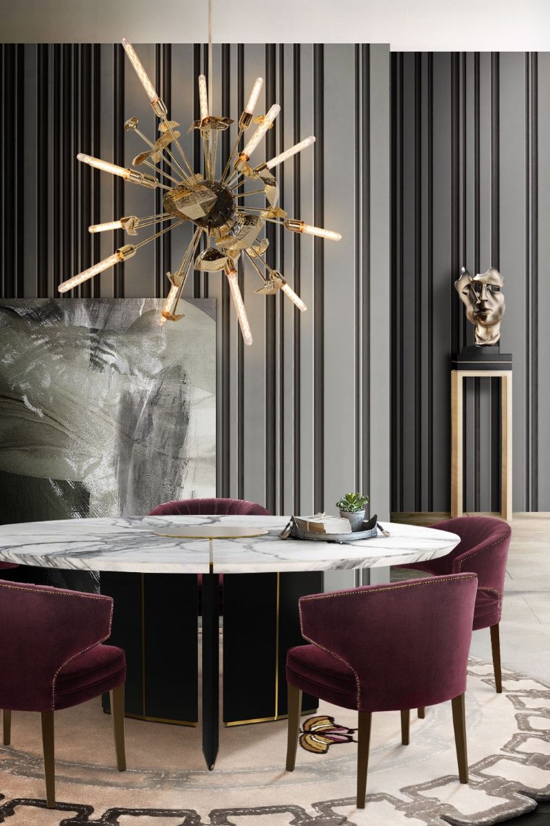 Contemporary dining room with METAMORPHOSIS RUG in gray tones with golden suspension lights. The Best Minimalist Rugs For The Dining Room