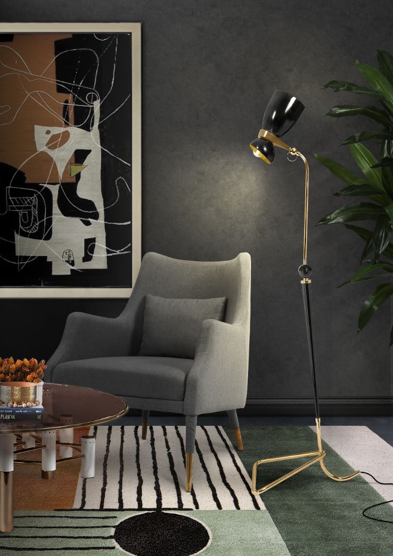 Modern midcentury living room corner with fantastic SIMBA RUG with a geometric pattern and gray armchair with standing lamp. Colorful Geometric Living Area Rugs For Dark Wood Floors