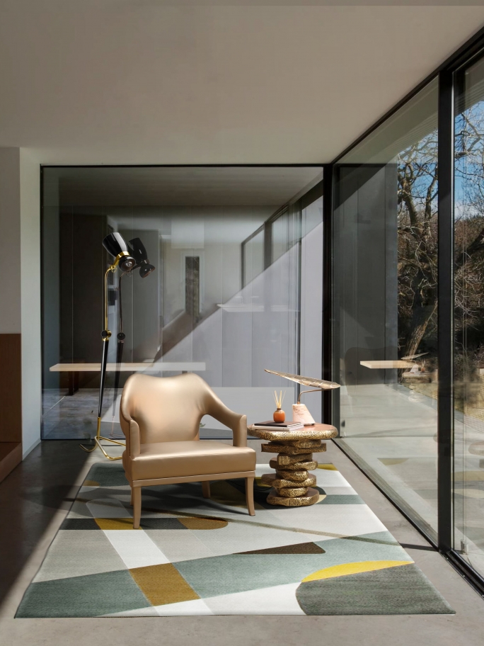 Modern mid-century living room reading corner with the gray JOH RUG with a geometric design, golden armchair and sidetable Colorful Geometric Living Area Rugs For Dark Wood Floors