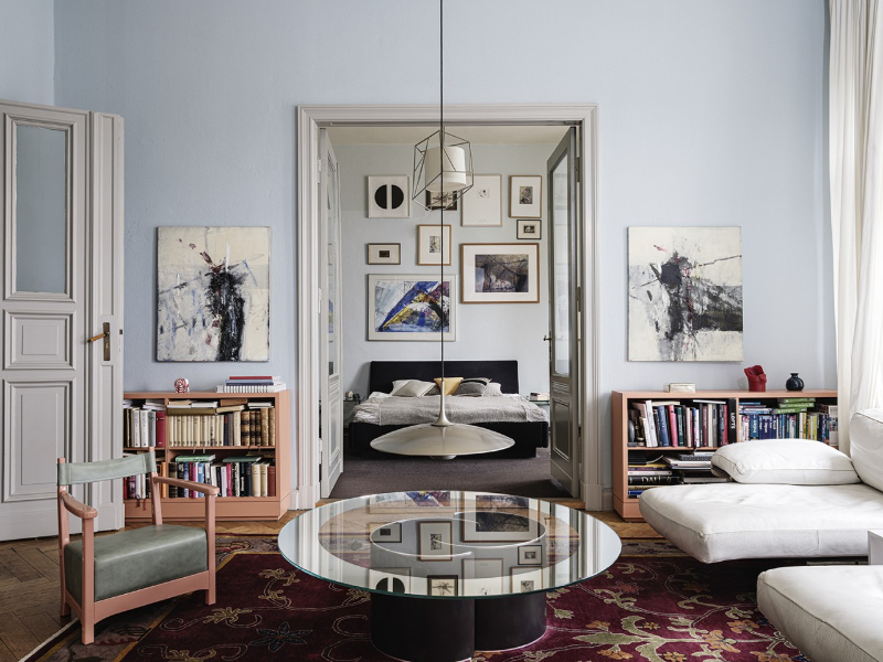 Gisbert Pöppler, Making the Boder Center living room and bedroom. with a floral area rug and a glass cneter tables