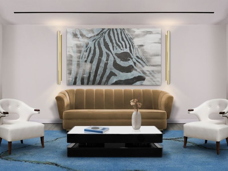 living room by rug'society with blue rug, white armchairs, beige sofa and black and white coffee table