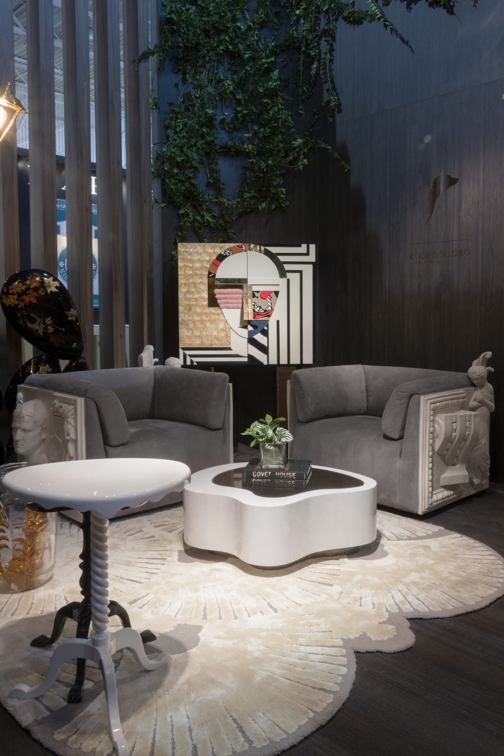 modern contemporary living room with gray and white area rug and gray amrchairs. Maison et Objet: Stands You Can't Miss This Year