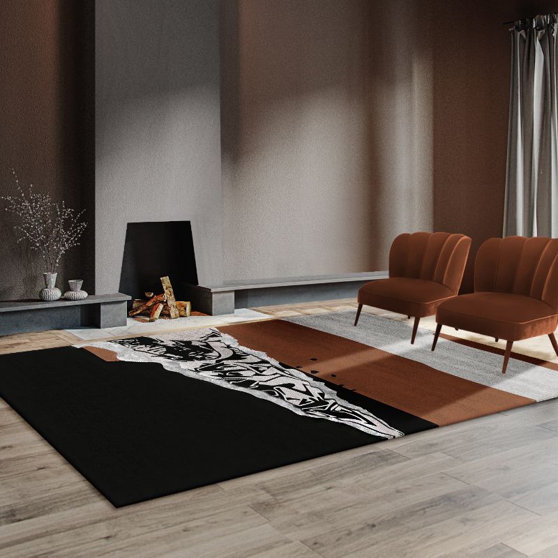 Modern living room with urban rug in black and brown with a street art design.  Modern Classic Rug Ideas For the Living Room