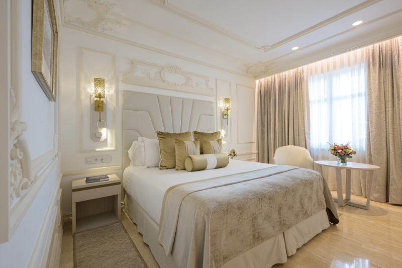 Bedroom by Aneta Mijatovic with white heaboard and white center table