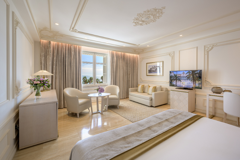 Bedroom by Aneta Mijatovic with white furniture and beige rug