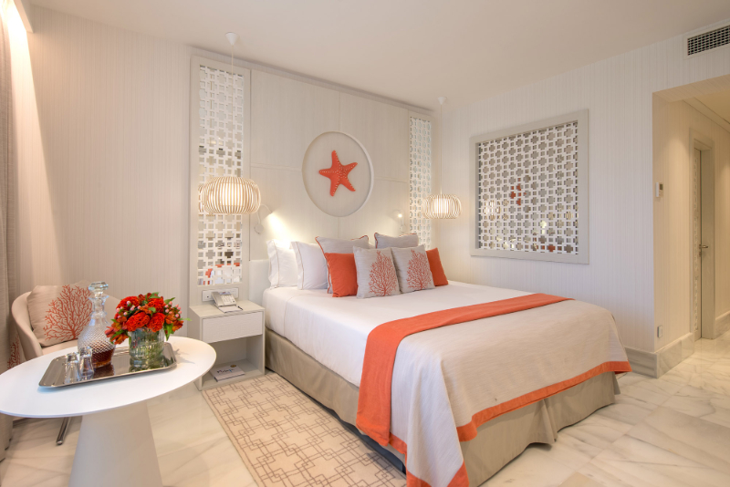 Bedroom by Aneta Mijatovic with orange details