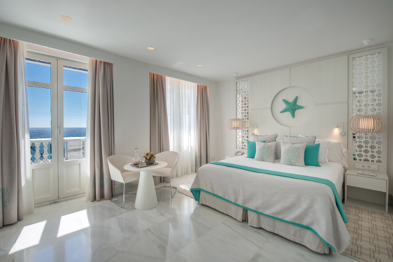 Bedroom by Aneta Mijatovic with green details and white furniture