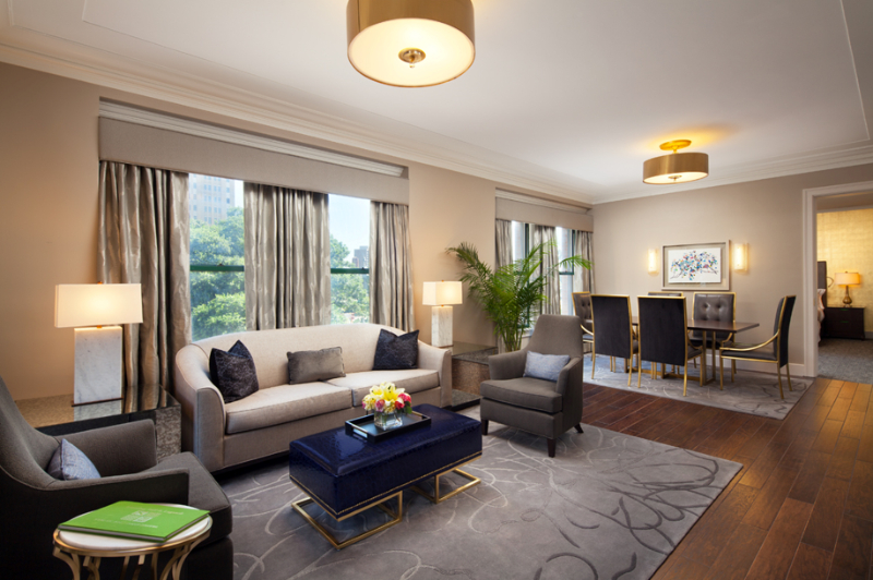 Forrest Perkins: Contemporary Rugs In Hospitality Projects. A room with a living room and dining room area, with matching rugs.