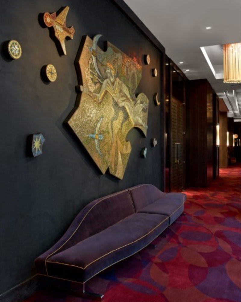 Forrest Perkins: Contemporary Rugs In Hospitality Projects. A corridor of the hotel with a very colorful rug in pink and purple tones.