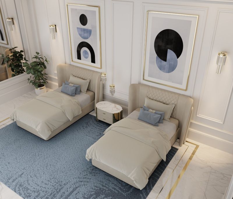 A blue area rug for a guest bedroom with two single beds