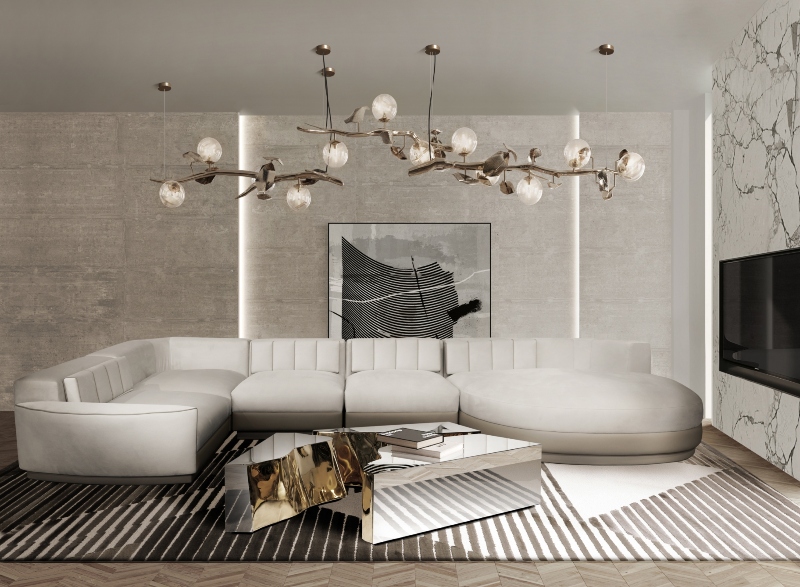 Rug designs from Mason Studio. This contemporary living room has The Air rug in grey light and dark and white, a white sofa, a silver coffee table and a golden suspencion chandelier.