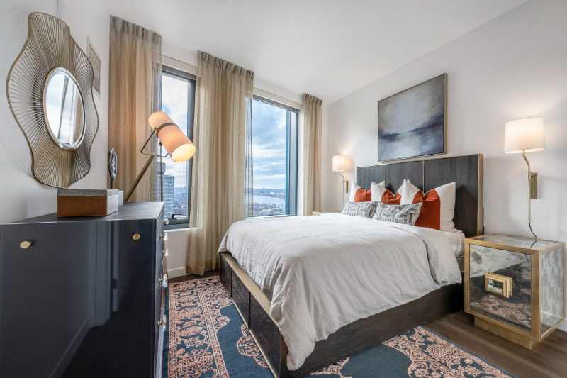 Rug Design Inspiration From Faulkner Design Group. In this bedroom there is a beautiful blue and gold rug under the bed.