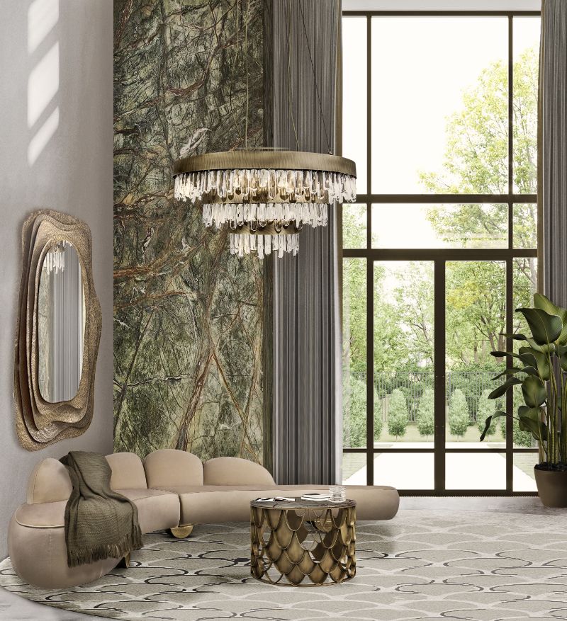 Boho Chic Living Room Ideas with neutral round rug and curved sofa with chandelier in brass