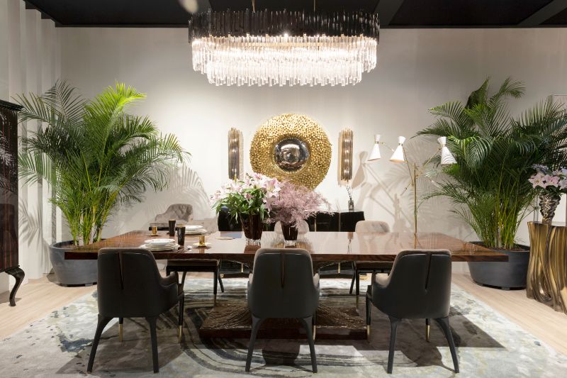 isaloni 2022: contemporary dining room with blue and gray area rug that matches with the gray dining chairs and suspension lights