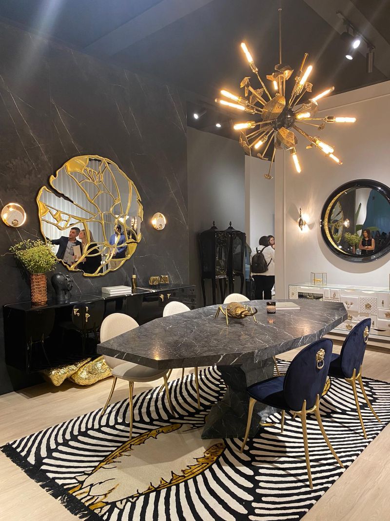An opulent dining room at Salone Del Mobile with a modern black and white rug