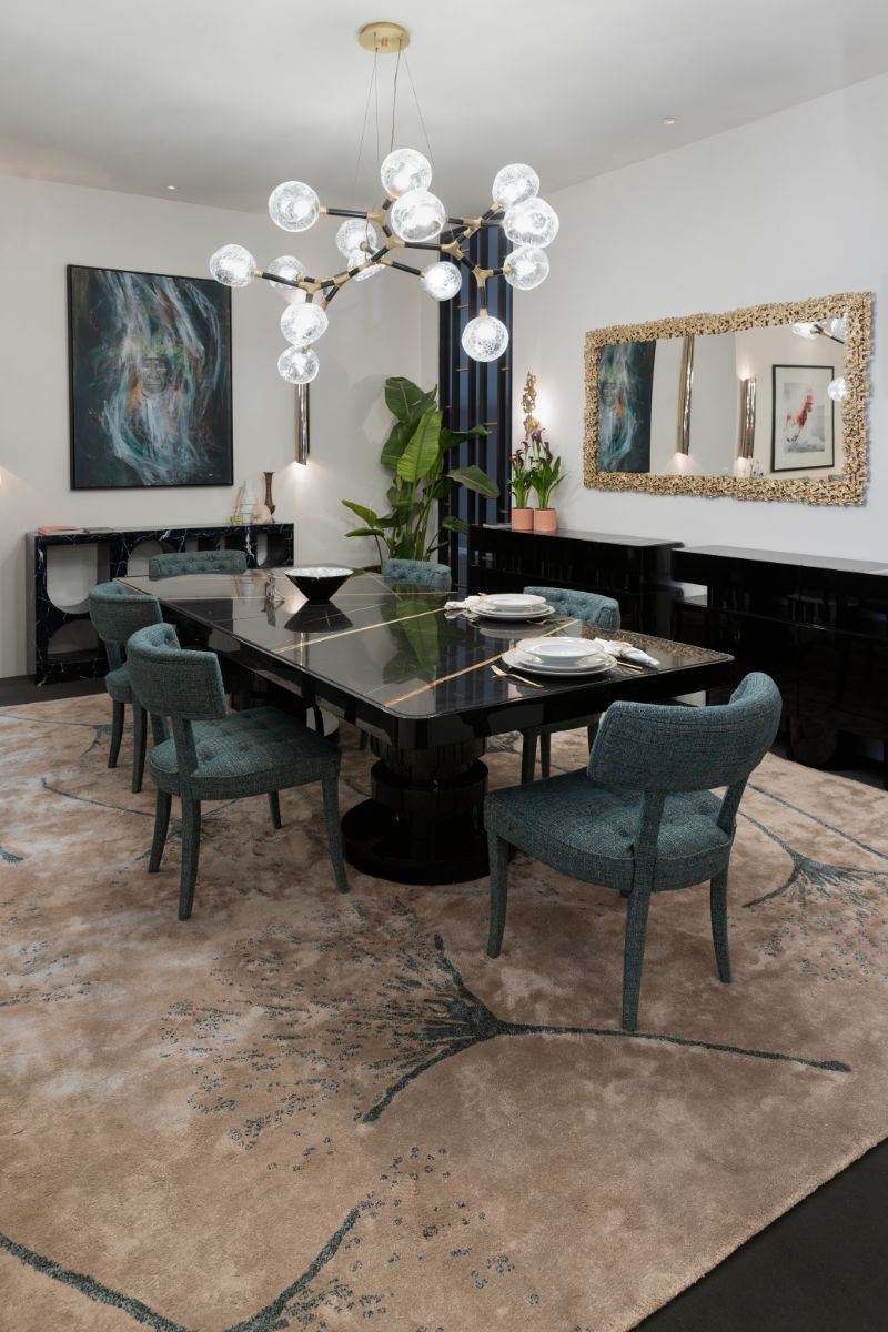 The Best of iSaloni 2022's Interior Design Trends. minimalist dining room with black dining table and blue chairs.