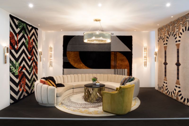The Most Mesmerizing Design Moments of Salone del Mobile - living room decor with round rug in golden and silver hues with curved sofa and wall rugs decorating the space