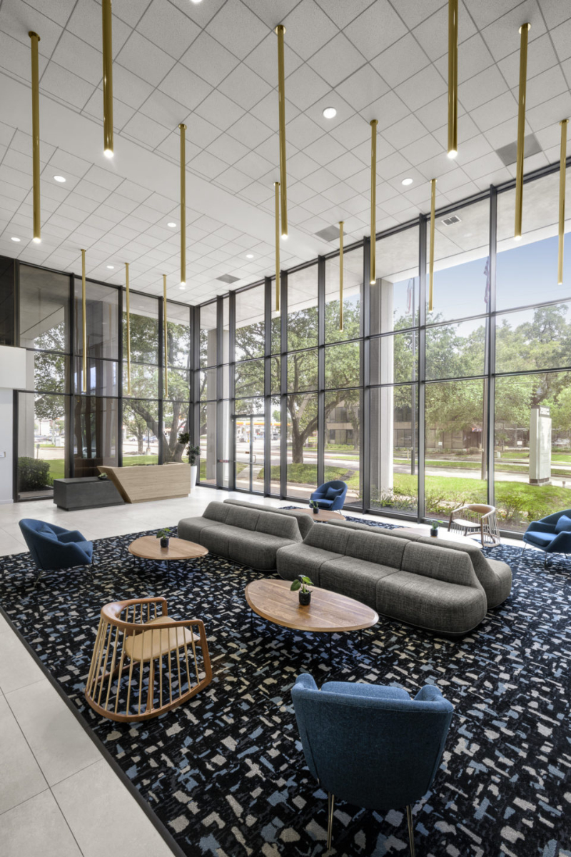 Abel Design Group: Rug Design Inspiration. In this living area of the hotel lobby there are many sofas and armchairs over a lounge rug.