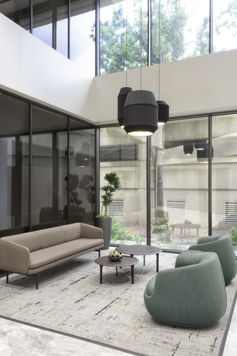 Abel Design Group: Rug Design Inspiration. This smaller living area has a nice rug, a sofa, two single sofas, and a center table.