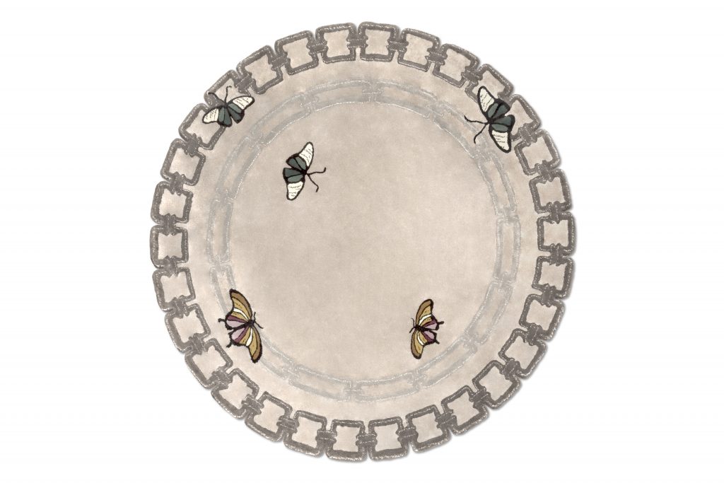 round neutral rug with butterfly design