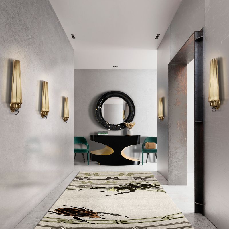Hallway Runner Rug Ideas with neutral hues and long rug with golden bugs and console with round mirror