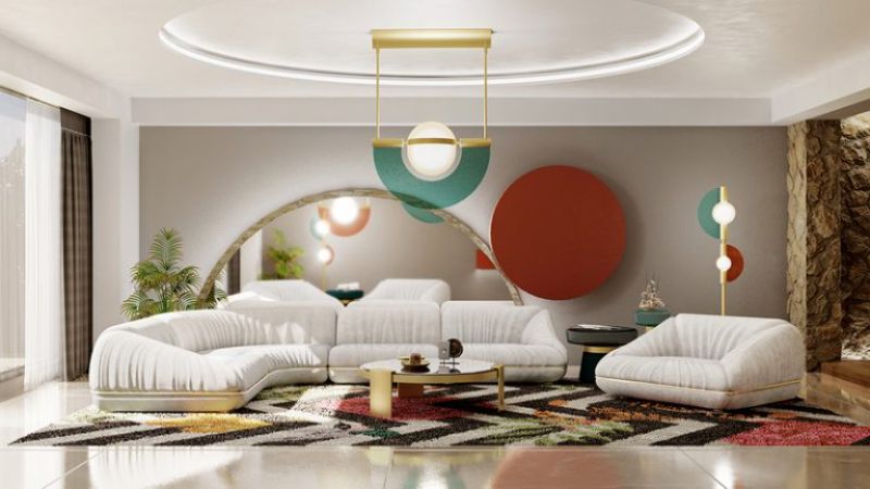 8 Fall Rugs We Love For The Living Room. modern living room with black and white rug and white sofa