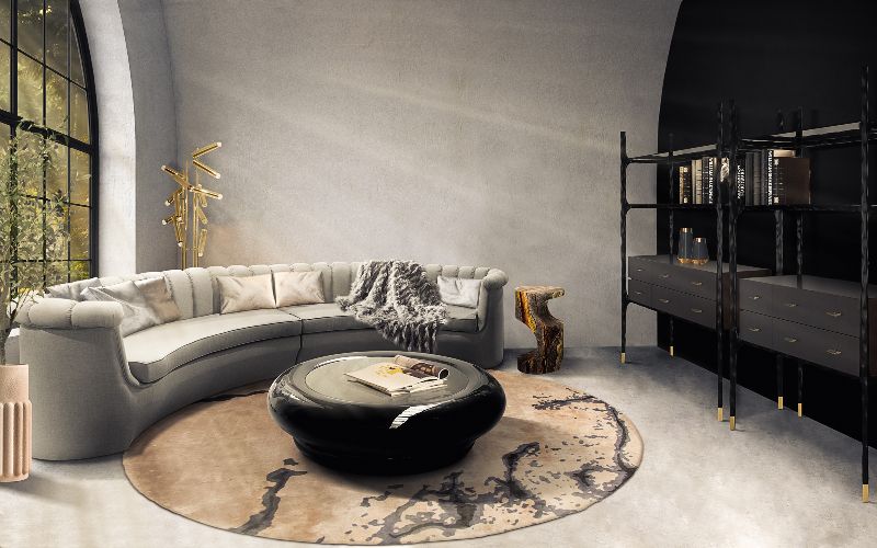 8 Fall Rugs We Love For The Living Room. Neutral round rug with curved sofa