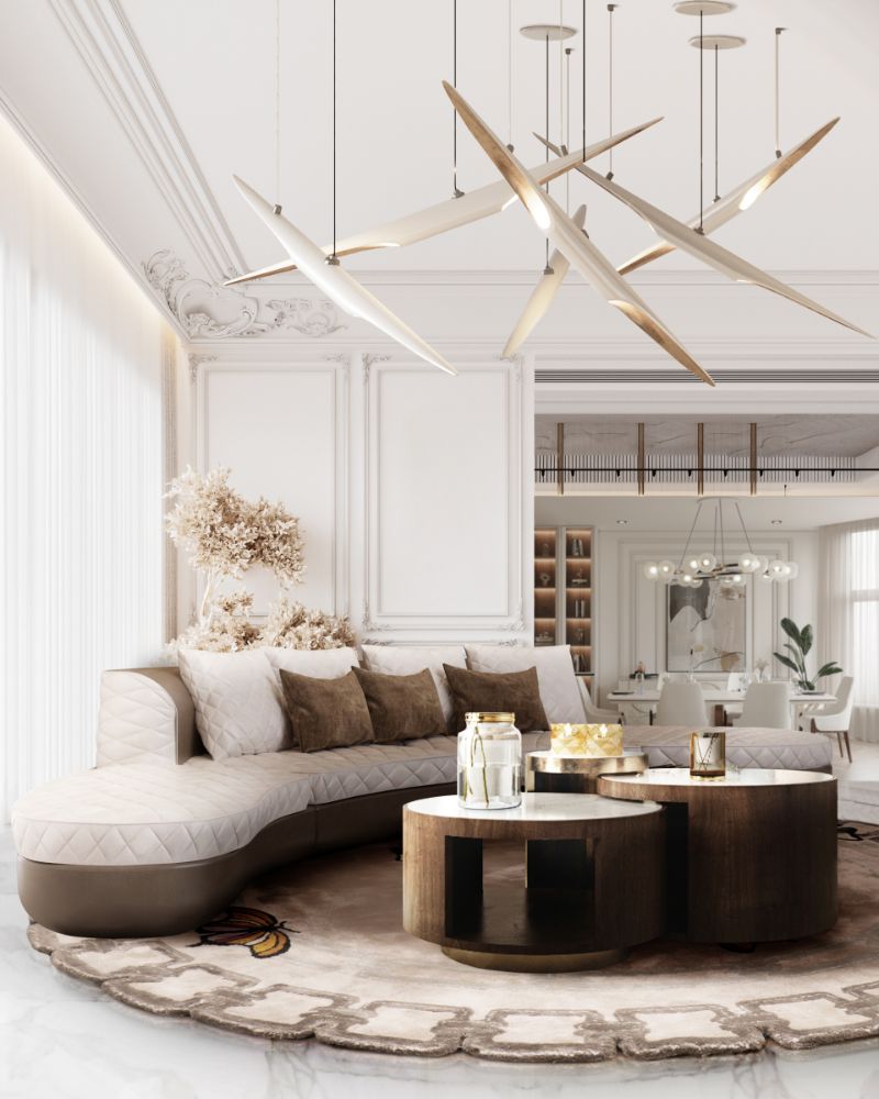 8 Fall Rugs We Love For The Living Room. Neutral round rug with curved sofa in same tones and center table made of wood