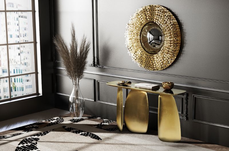 Modern Entryway Ideas For A Slick And Stylish Entrance For Your Home with beige rug and golden mirror and console