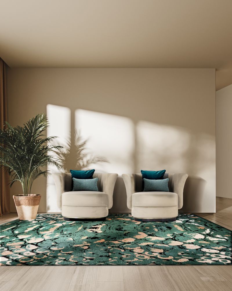 biophilic interior design with green reptilus rug and beige armchairs