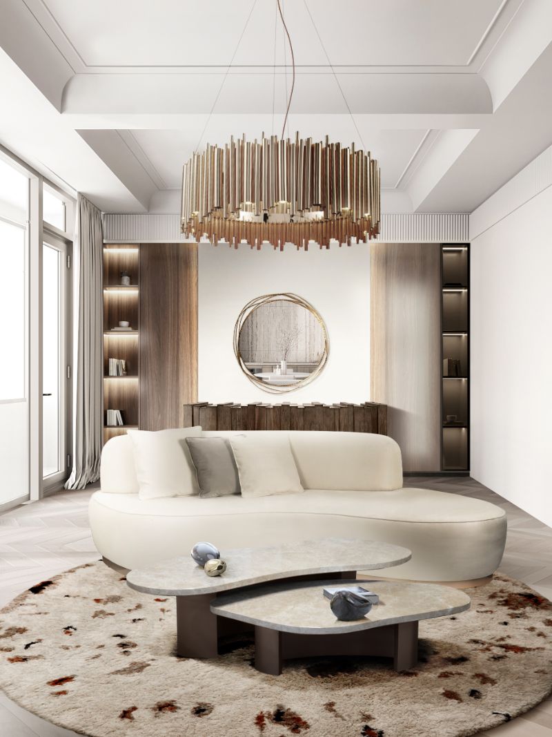 This modern contemporary living room has an elegant design with the white round OLSO RUG and the curved ODETTE SOFA.