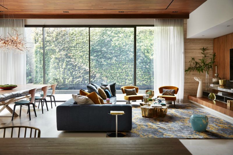 This colorful area rug brings a cheerful ambiance to this living room decor. Having a tidy and organized place brings peace to your mind and makes you feel comfortable inside your home.