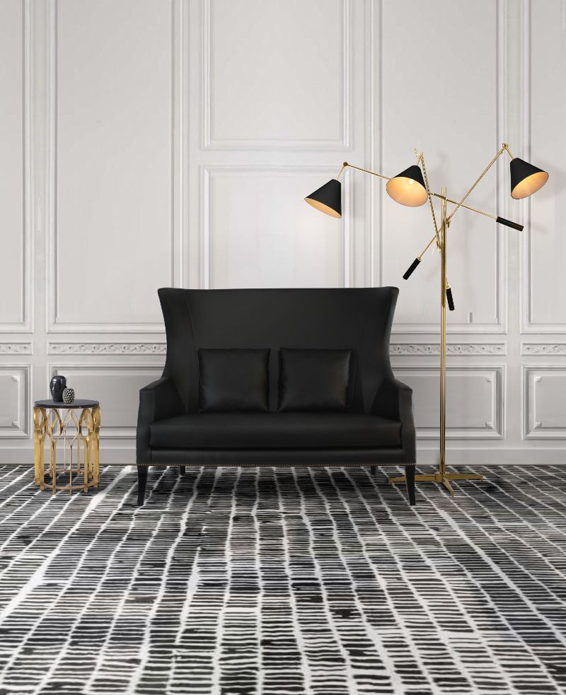 Step Into The Fall Season With The Coziest Rugs. Black and white modern living room decor with black armchair and black and white modern rug