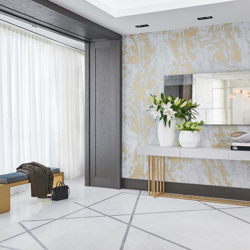 Maxine Tissenbaum And The Art of Bespoke Interior Designs. Luxurious hallway decor with area rug.