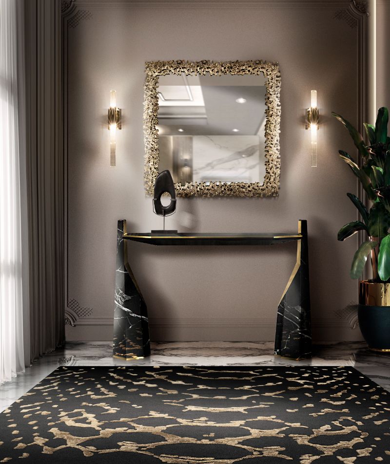 The META RUG is a stunning piece with dark and golden hues that creates a sophisticated ambiance. It is a hand-tufted rug made of natural wool and botanical silk which grants a cozy atmosphere with an elegant flair.