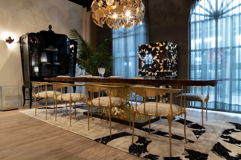 This opulent-looking dining room has 2 key elements that make it feel so expensive. It is of course the alluring IMPERIAL SNAKE RUG and the METAMORPHOSIS dining room table. This luxury dining table